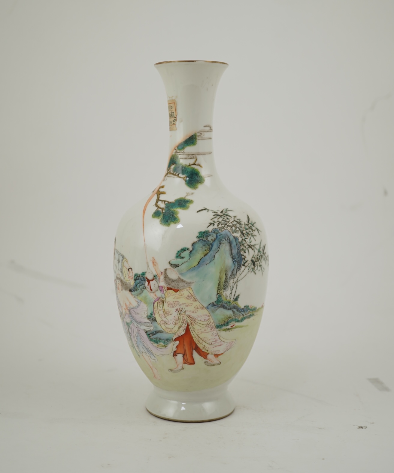 A Chinese famille rose ‘Liu Hai’ bottle vase, Qianlong six character seal mark but Republic period